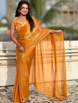 Mustard yellow shimmer satin tissue saree with golden tassels 5