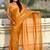 Mustard yellow shimmer satin tissue saree with golden tassels
