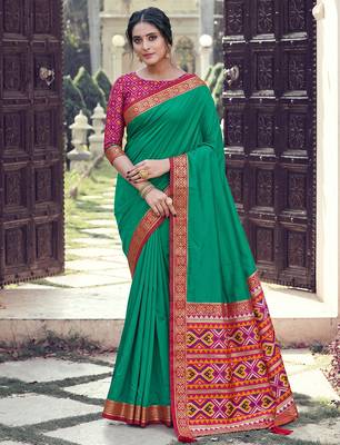 emerald green soft silk blend saree for women with rani pink blouse festive party wedding wear 1