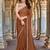 Brown saree with embellished mirror work border & unstitched blouse