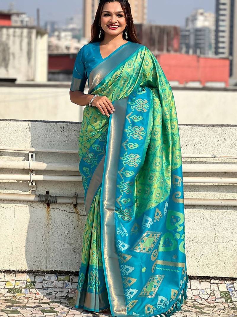 Green woven design zari silk blend patola saree