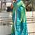 Green woven design zari silk blend patola saree