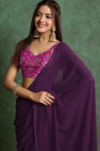 Purple sequinned border saree with heavy embroidered blouse piece