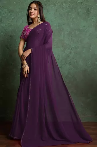 Purple sequinned border saree with heavy embroidered blouse piece