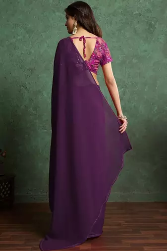 Purple sequinned border saree with heavy embroidered blouse piece