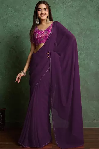 Purple sequinned border saree with heavy embroidered blouse piece