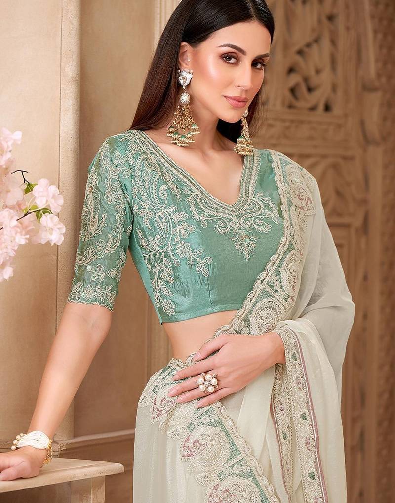Off white ethnic motifs embroidered  georgette heavy work saree