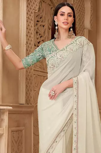 Off white ethnic motifs embroidered  georgette heavy work saree