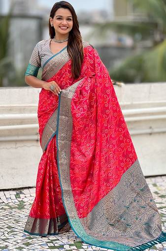 Pink ethnic motifs woven design zari patola saree