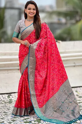 Pink ethnic motifs woven design zari patola saree