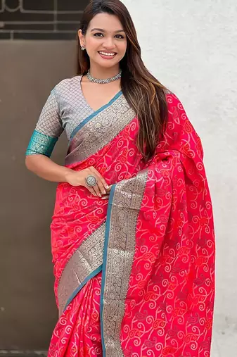 Pink ethnic motifs woven design zari patola saree