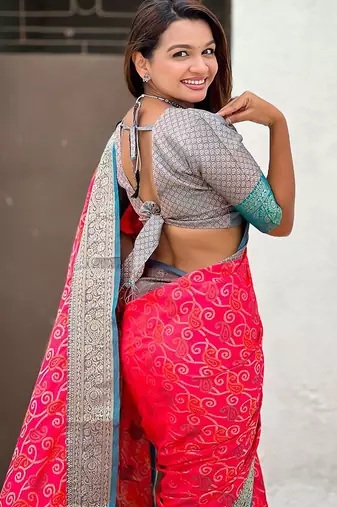 Pink ethnic motifs woven design zari patola saree