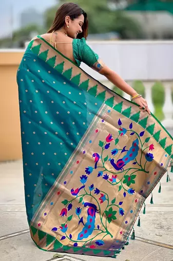 Green ethnic motifs woven design zari detail paithani saree