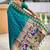 Green ethnic motifs woven design zari detail paithani saree