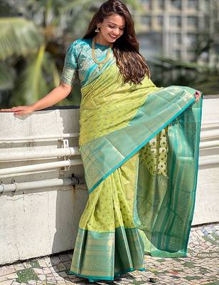 Green woven design zari silk blend kanjeevaram saree 1