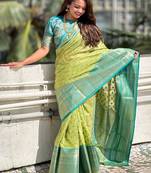 Green woven design zari silk blend kanjeevaram saree