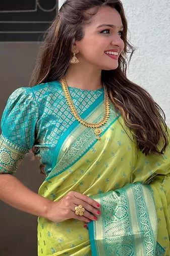Green woven design zari silk blend kanjeevaram saree