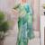Green beads and stones organza saree