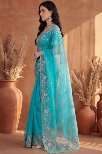 Turquoise embroidered organza saree