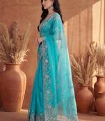 Turquoise embroidered organza saree
