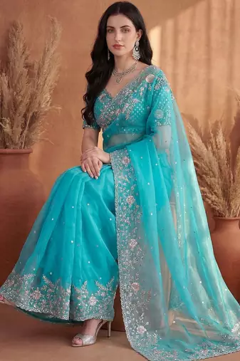 Turquoise embroidered organza saree