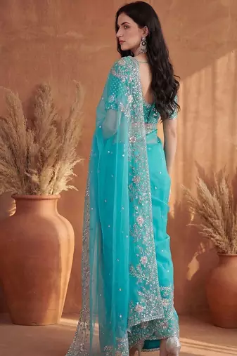 Turquoise embroidered organza saree