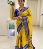 Yellow ethnic motifs zari kanjeevaram saree