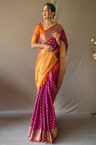 Purple ethnic motifs woven design zari patola saree
