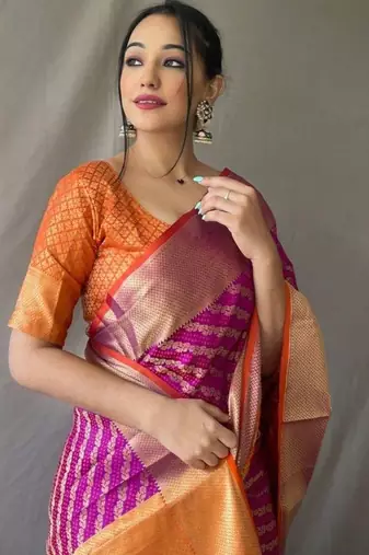 Purple ethnic motifs woven design zari patola saree