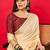 Peach solid mysore silk saree with woven design zari border