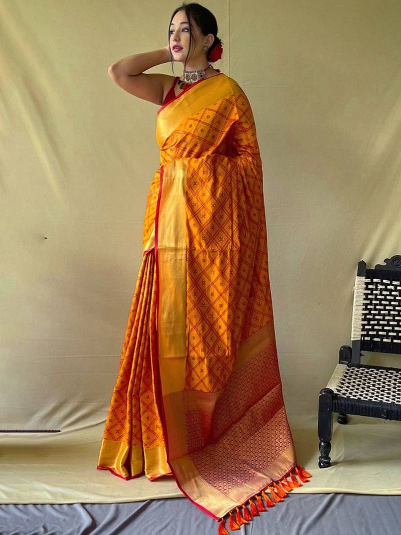 Yellow woven design zari patola saree