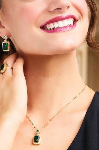Gold plated cubic zirconia studded green pendant chain drop earrings
