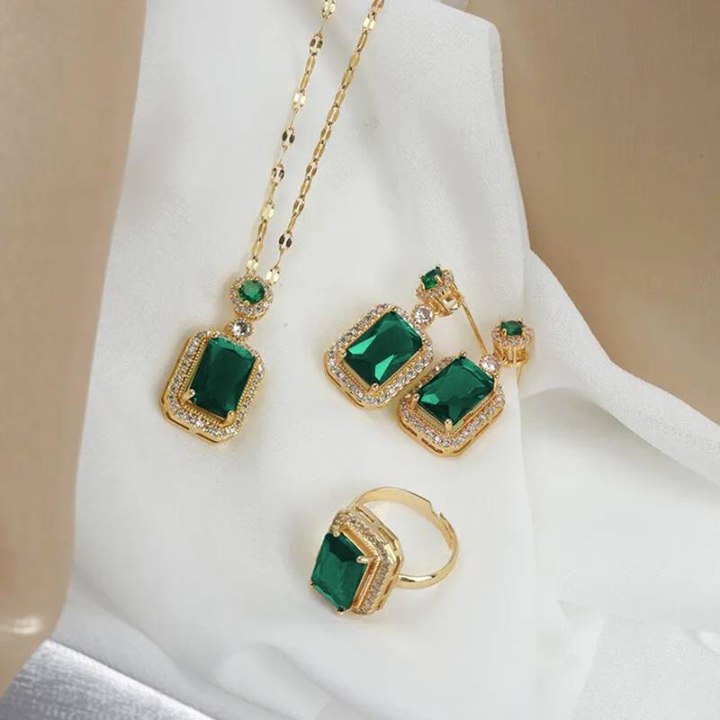 Gold plated cubic zirconia studded green pendant chain drop earrings