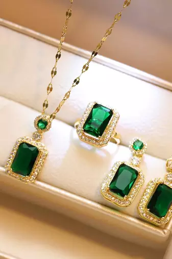 Gold plated cubic zirconia studded green pendant chain drop earrings