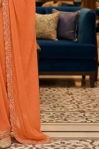 Orange woven design embroidered poly georgette leheriya saree