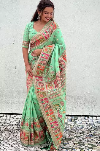 Green woven design silk blend saree