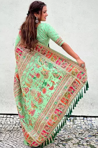 Green woven design silk blend saree