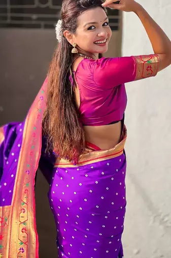 Purple ethnic motifs woven design zari paithani saree