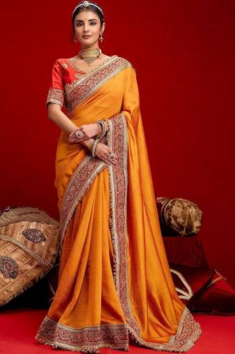 Orange embellished zari silk blend heavy work saree