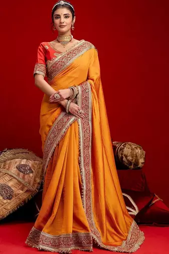 Orange embellished zari silk blend heavy work saree