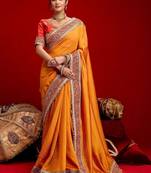 Orange embellished zari silk blend heavy work saree