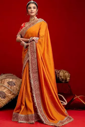 Orange embellished zari silk blend heavy work saree