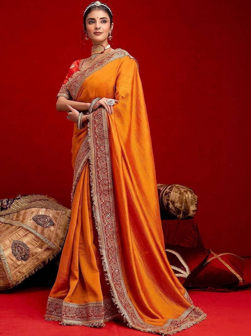 Orange embellished zari silk blend heavy work saree