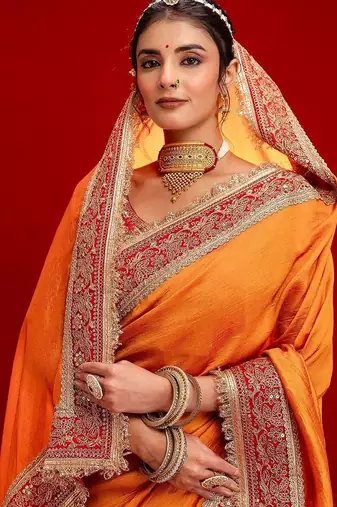 Orange embellished zari silk blend heavy work saree