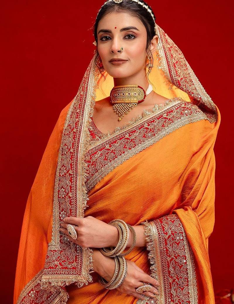 Orange embellished zari silk blend heavy work saree