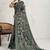 Teal floral printed sequinned tissue kanjeevaram saree