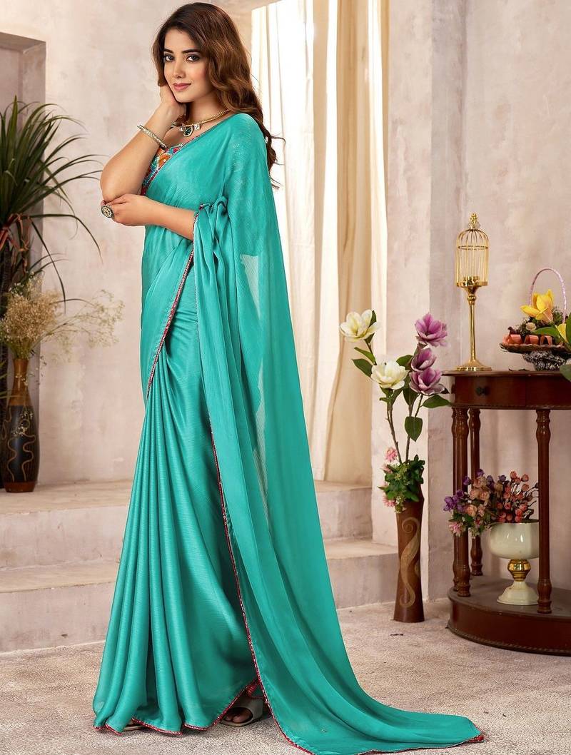 Turquoise kutchi embroidery satin designer saree