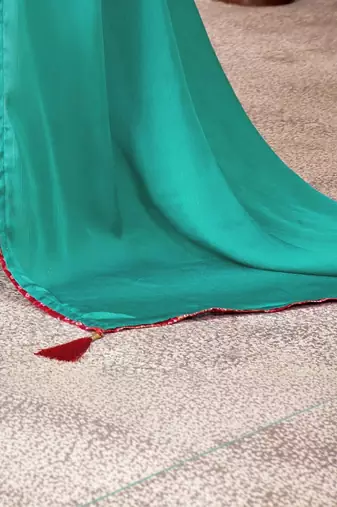 Turquoise kutchi embroidery satin designer saree