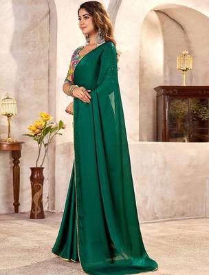 Green sequinned satin heavy work saree 1