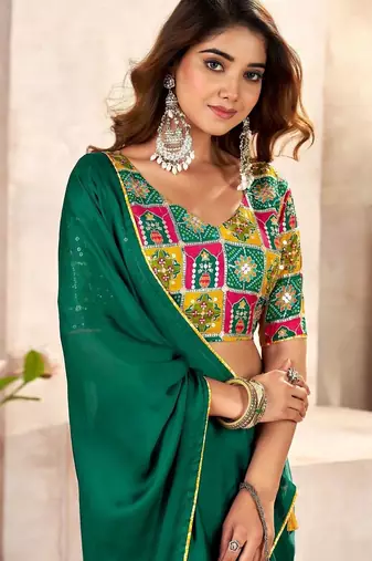 Green sequinned satin heavy work saree
